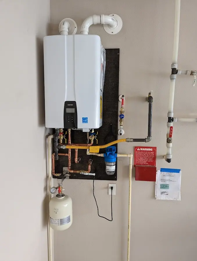 Professional plumber installing copper piping in a Clarksdale home